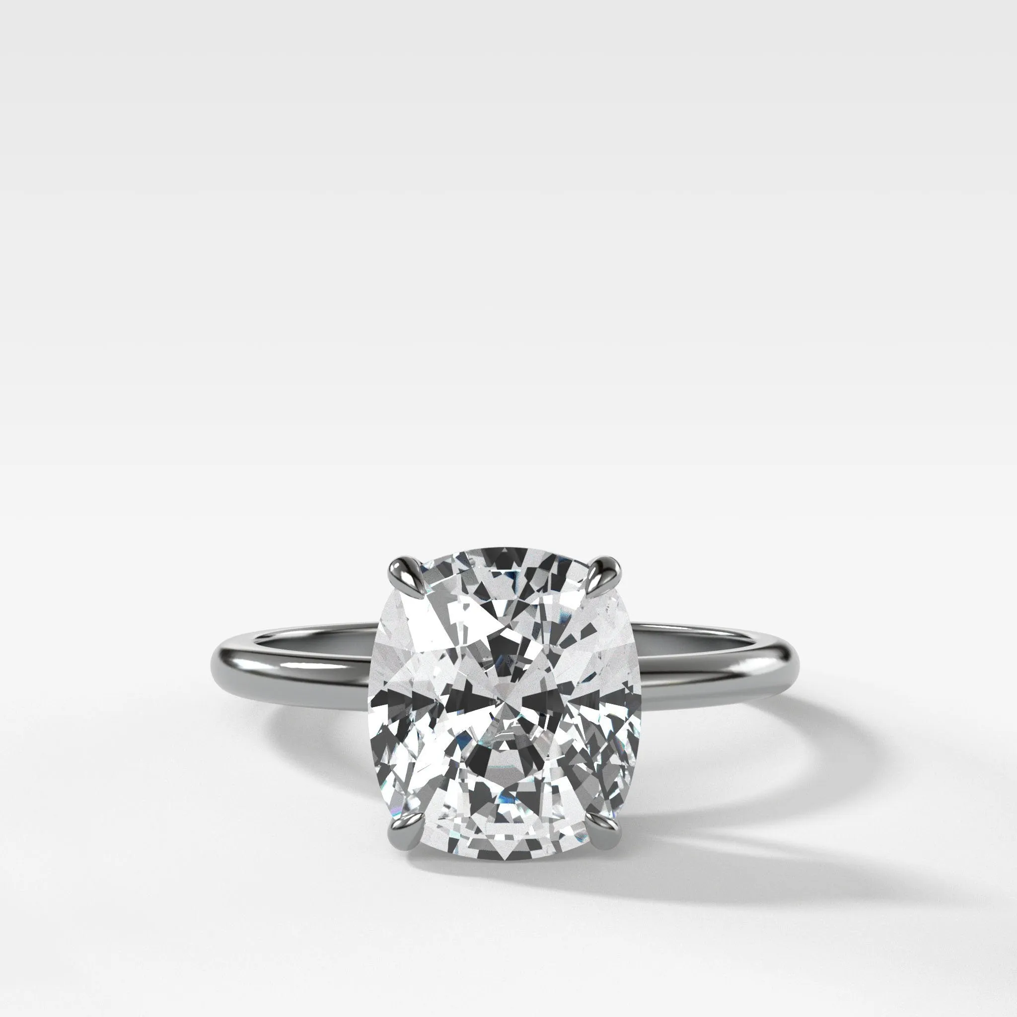 Thin   Simple Solitaire Engagement Ring With Elongated Cushion Cut Diamond