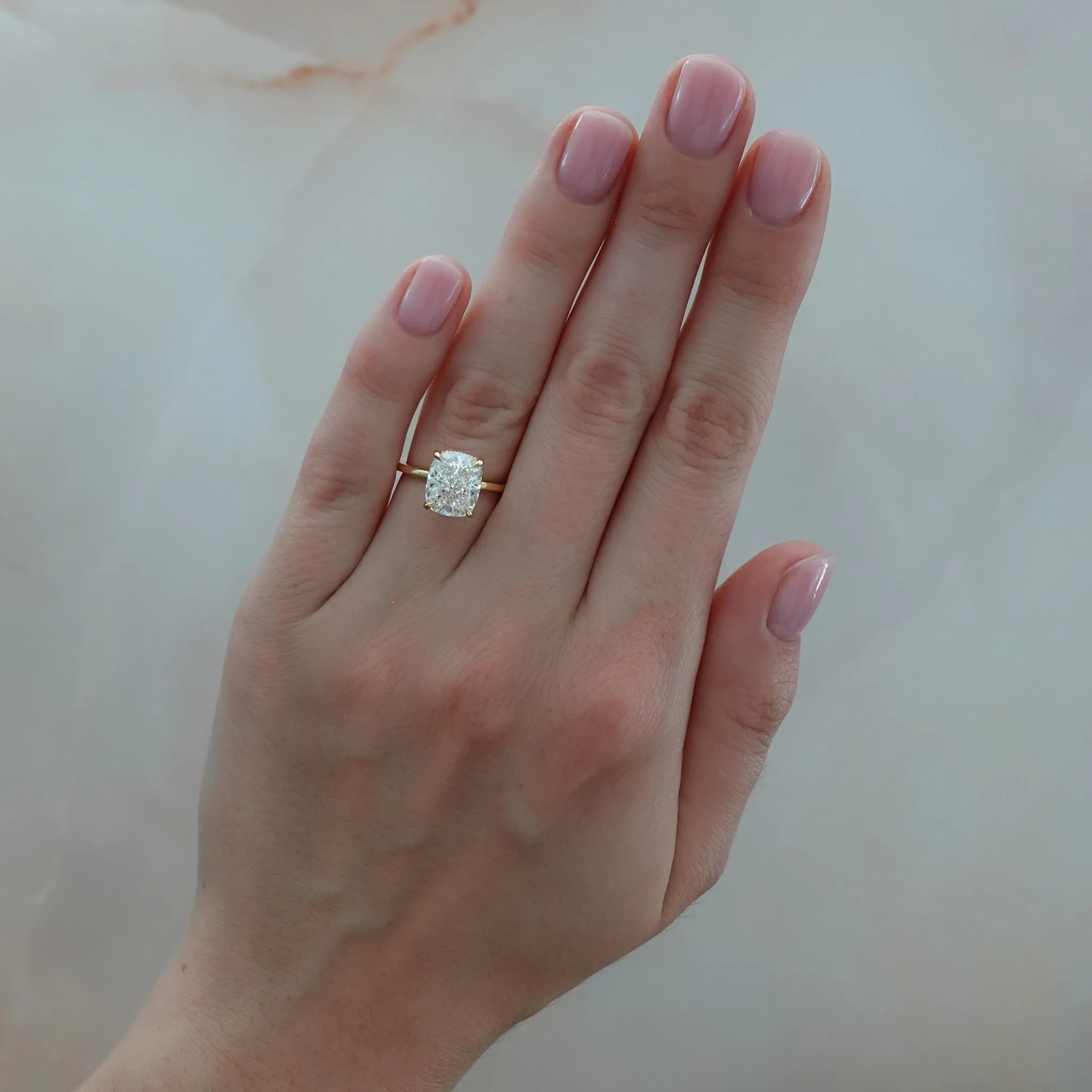 Thin   Simple Solitaire Engagement Ring With Elongated Cushion Cut Diamond